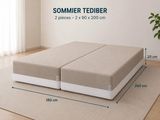 the bed frame is made of foam and has two pillows on it