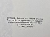 a close up of the back of a book with a black and white image