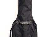 a guitar case sitting on the floor next to a wall