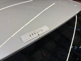a close up of a car with a sticker on it ' s hood