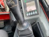 a close up of a car dashboard with a steering control