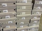 a lot of boxes stacked on top of each other in a warehouse