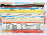 many children ' s books stacked on top of each other