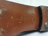 heel of a woman ' s shoe with a black band around the toe