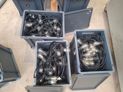 three bins filled with silver and black lights