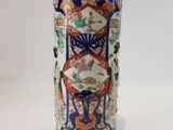 a vase that is sitting on a white table