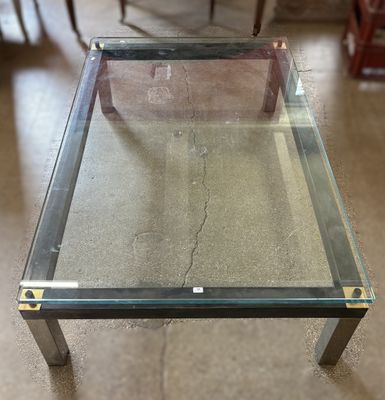 a glass table with a metal frame and a glass top