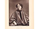 an old black and white photo of a woman in a cape
