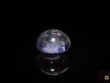an image of a blue and white stone on a black surface