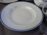many plates and bowls sitting on a table