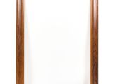an empty wooden frame on a white background