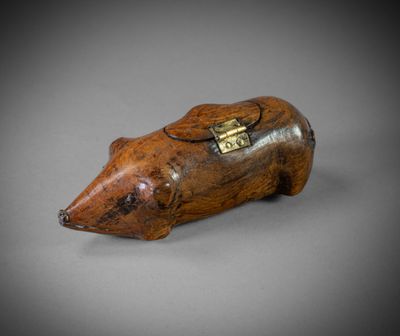 an old wooden animal figurine with a tag on it ' s neck