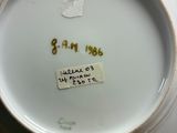 a close up of a white plate with a label on it