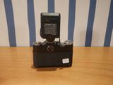 a small camera sitting on top of a wooden table