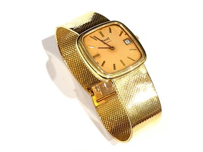 gold colored watch with a mesh band and a gold colored face