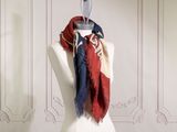 a mannequin with a red, white and blue scarf on it