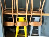 a lot of chairs and a table in a room
