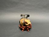 a small figurine of a man riding a horse