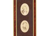 an old photo of two men in formal attire are shown in a picture frame