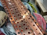 a pile of copper pipes and wires on the ground