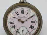 an old pocket watch with roman numerals on it