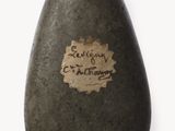 a stone with a sticker on it that says,