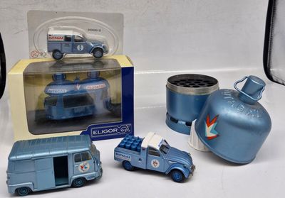 a blue toy truck and other toy vehicles on a table
