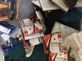 many items that are in a plastic bag on the bed