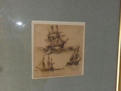 a picture of a picture of a ship in a glass case