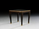 an image of a black and gold side table on a white surface