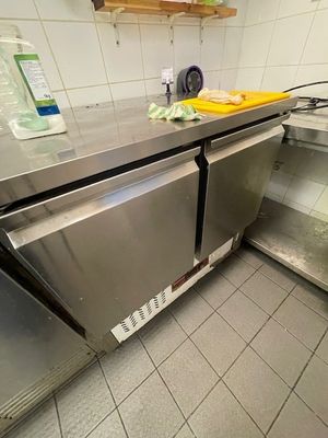 a stainless steel counter top in a commercial kitchen
