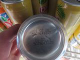 a person holding a can of soda in their hand