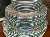 many plates stacked on top of each other on a table