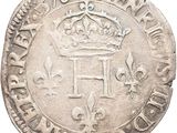 a close up of a coin with a crown on it
