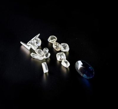several different types of diamonds on a black surface
