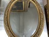 a mirror that is sitting on the floor in front of a mirror