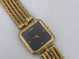 a close up of a gold wrist watch with a black face