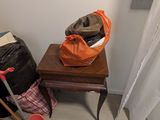 a pile of luggage sitting on a table next to a window