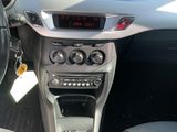 a car dashboard with a clock on it and a steering wheel