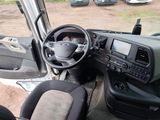 a view of the inside of a vehicle from the driver ' s seat