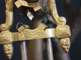 a close up of a metal object on a stand