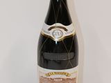 a bottle of wine that is sitting on a table