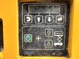 a close up of a control panel on a yellow machine