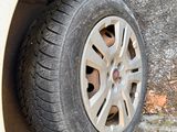 a tire that is sitting on the side of the road