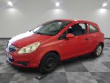 the small red car is parked in the garage on a checkered floor