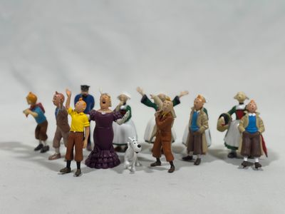 toy figurines of a group of people standing in front of a white background