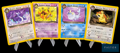 four pokemon cards are lined up in a row on a black background