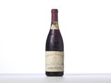a bottle of wine that is sitting on a table