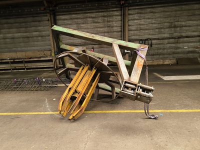 a pile of wood and metal on the ground in a warehouse