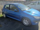 a blue car that is parked in a parking lot